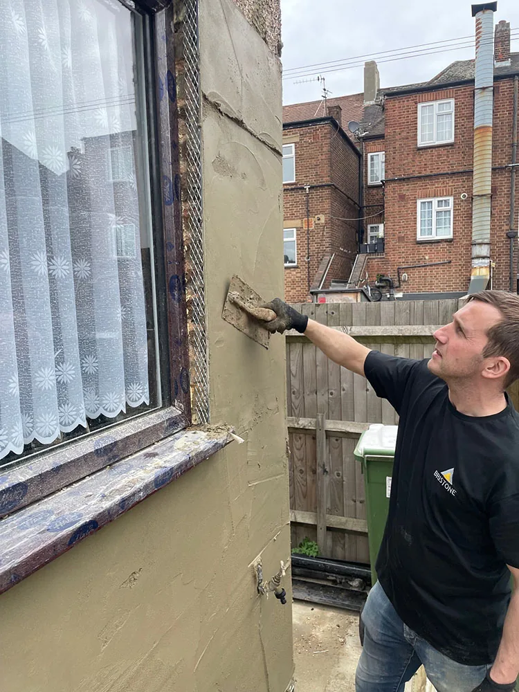 Bristone builder applying external render